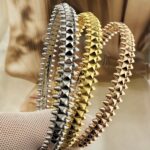 Жорсткий браслет Cartier Clash з рухливими елементами та логотипом