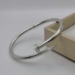 Жорсткий браслет-цвях Cartier з камінням цирконію на кінцях срібло2