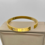 Класичний жорсткий браслет Cartier з камінням лимонне золото, застібка