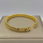 Жорсткий браслет Cartier Clash з рухливими елементами лимонне золото, застібка