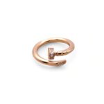 Каблучка-цвях Cartier з камінням та лого рожеве золото1