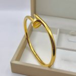 Жорсткий браслет-цвях Cartier лимонне золото1