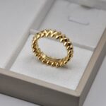 Каблучка Cartier Clash з рухливими елементами та логотипом лимонне золото лого