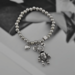 Кульковий браслет із підвіскою у вигляді ведмедика та сердечка1