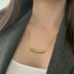 Підвіс Cartier Clash з рухливими елементами лимонне золото на тілі