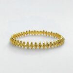 Браслет Cartier Clash з рухливими елементами та логотипом лимонне золото