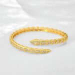 Жорсткий браслет з камінням BVLGARI у вигляді змії золото2