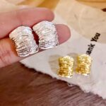 Сережки у вигляді розплавленого металу та маленьких хвиль