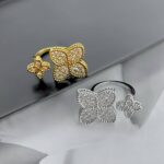 Універсальна каблучка з двома квіточками та камінням