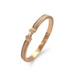 Вишуканий жорсткий браслет Hermes з логотипом у золоті бежевий