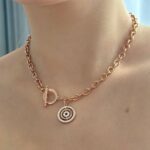 Підвіс BVLGARI з камінням та логотипом золото на тілі