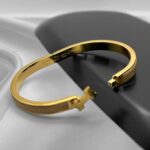Вишуканий жорсткий браслет Hermes з логотипом у лимонному золоті бежевий лого
