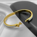 Вишуканий жорсткий браслет Hermes з логотипом у лимонному золоті білий лого