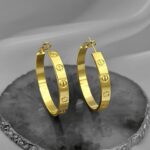Великі сережки-кільця Cartier золото