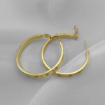 Великі сережки-кільця Cartier золото застібка