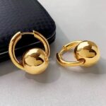 Великі сережки-кульки Balenciaga з логотипом золото
