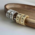 Сережки пів-кільця Louis Vuitton з камінням та логотипом