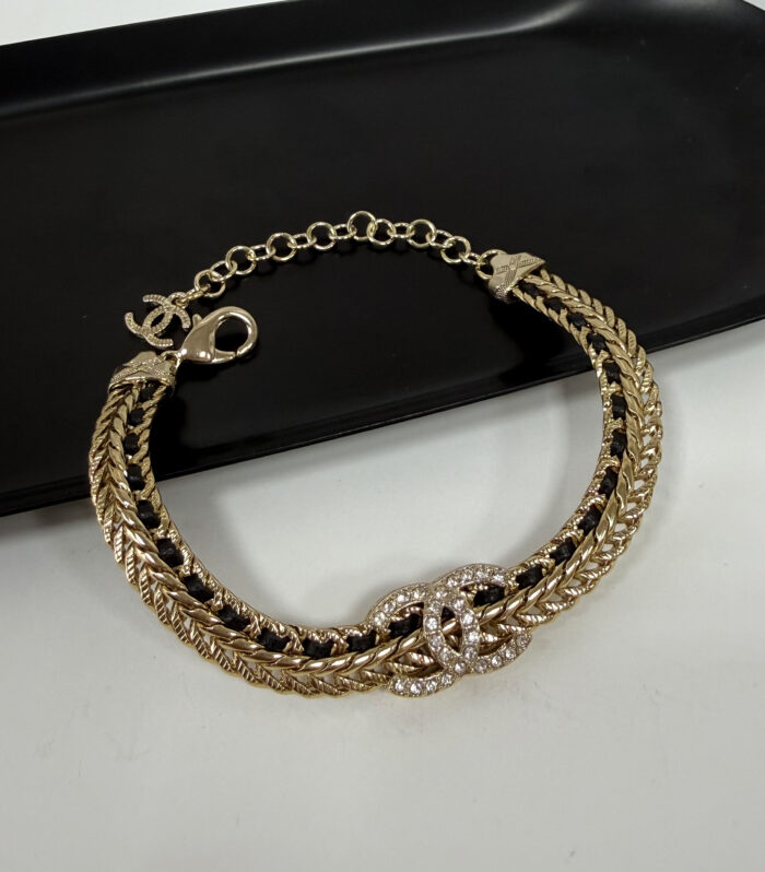 Плетений браслет Chanel з камінням
